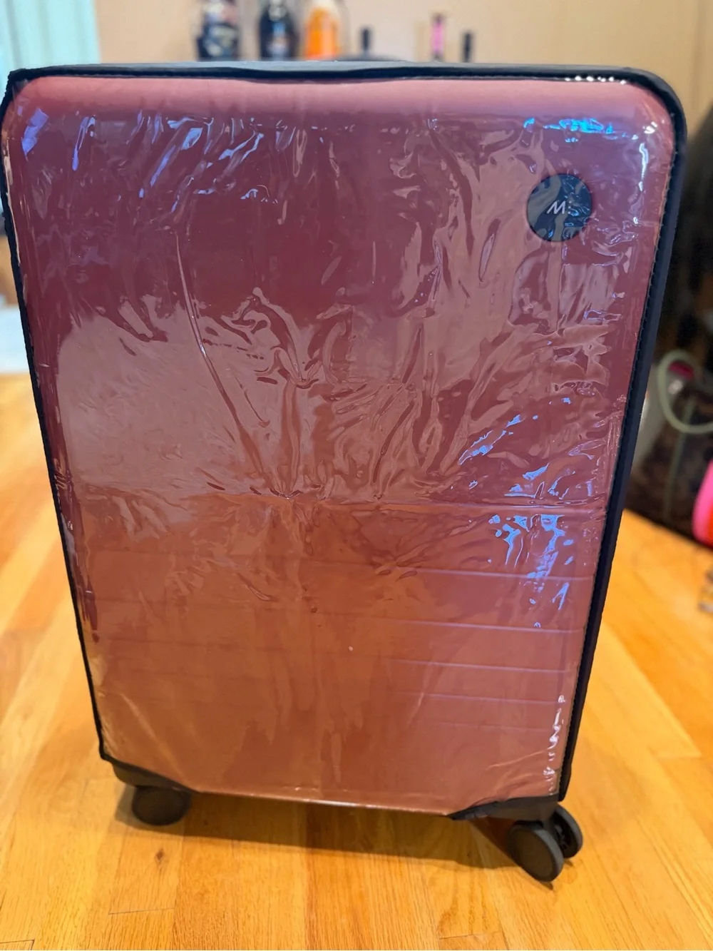 Monos medium check in 24” terracotta color suitcase LIKE NEW